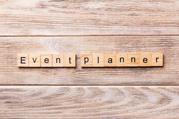 EVENT PLANNER word written on wood block. EVENT PLANNER text on wooden table for your desing, concept.