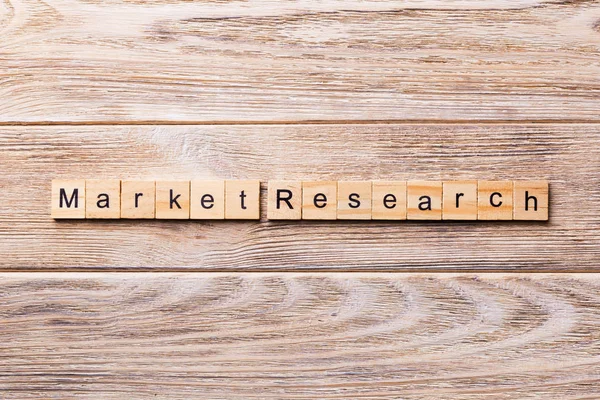 Market Research word written on wood block. Market Research text on wooden table for your desing, concept.