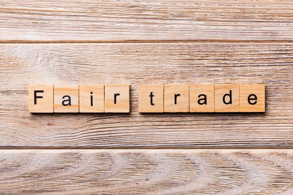 fair trade word written on wood block. fair trade text on wooden table for your desing, concept.