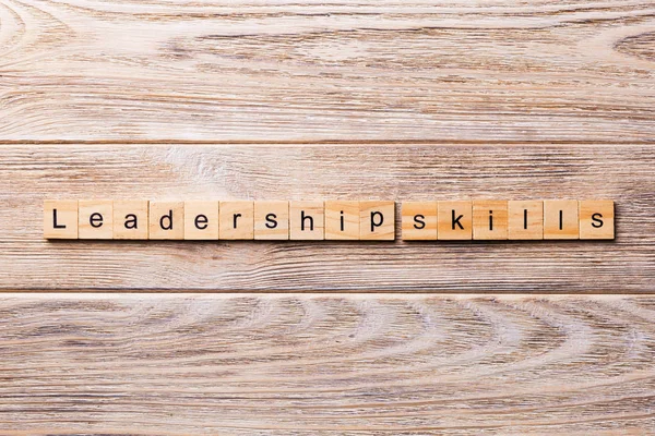 Leadership skills word written on wood block. Leadership skills text on wooden table for your desing, concept.