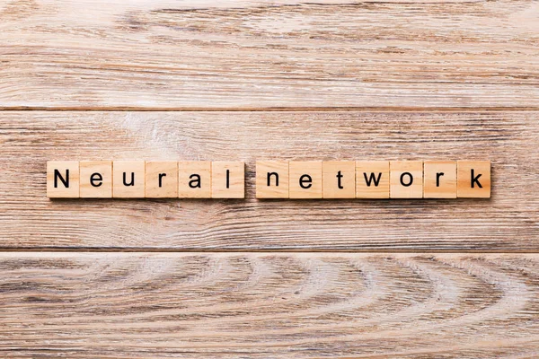 NEURAL NETWORK word written on wood block. NEURAL NETWORK text on wooden table for your desing, concept.