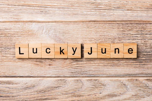 lucky June word written on wood block. lucky June text on table, concept.