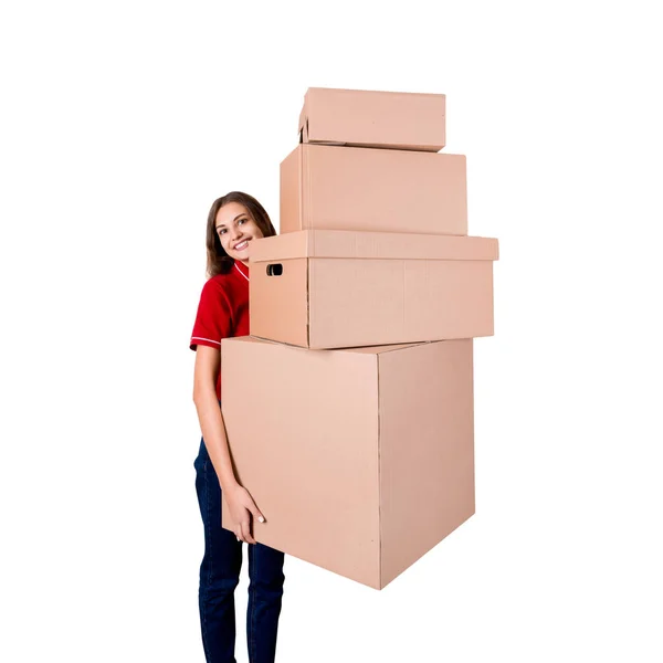 Smiling businesswoman is holding a lot of big cardboard boxes isolated on white background — Stock Photo, Image