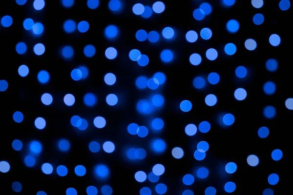 Unfocus astratto colorato bokeh sfondo nero. sfocato e sfocato molti rotonda luce blu — Foto Stock