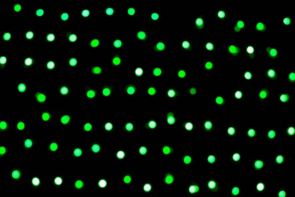 Bokeh verde astratto sfocato su sfondo nero. sfocato e sfocato molti luce rotonda — Foto Stock