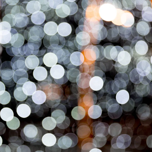 Abstract bokeh of white city lights on black background. defocused and blurred many round light — Stock Photo, Image