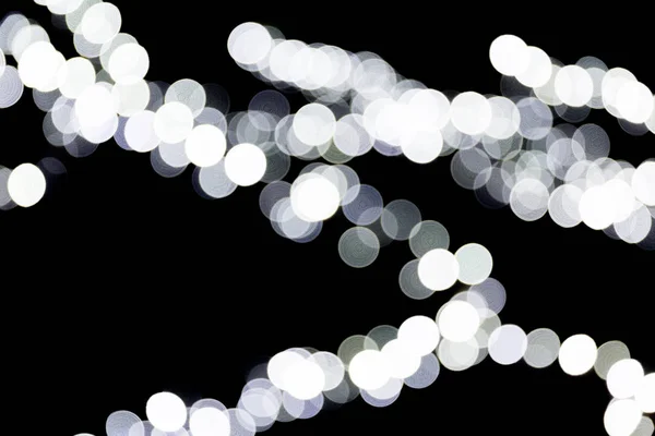 Bokeh bianco astratto sfocato su sfondo nero. sfocato e sfocato molti luce rotonda — Foto Stock