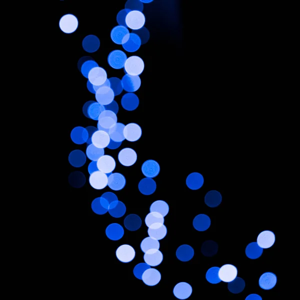 Unfocus astratto colorato bokeh sfondo nero. sfocato e sfocato molti rotonda luce blu — Foto Stock