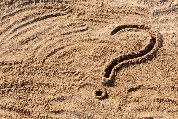 Question marks written on beach sand close up, with copy space — Stock Photo, Image