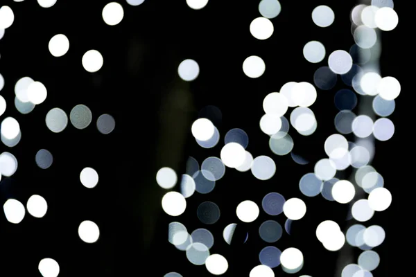 Sfocatura astratta sfondo bokeh bianco e nero. molti luce rotonda su sfondo — Foto Stock