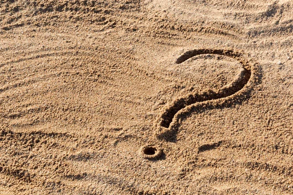 Question marks written on beach sand close up, with copy space — Stock Photo, Image