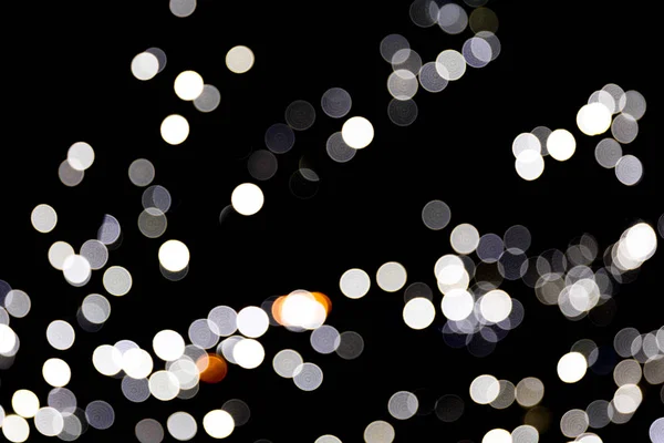 Abstrato bokeh luz como fundo desfocado e desfocado muitos luz redonda no fundo preto — Fotografia de Stock