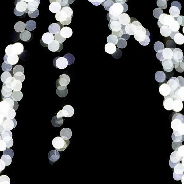 Abstract bokeh of white lights on black background. defocused and blurred many round light — Stock Photo, Image