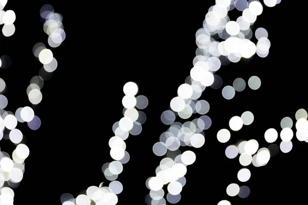 Bokeh bianco astratto sfocato su sfondo nero. sfocato e sfocato molti luce rotonda — Foto Stock