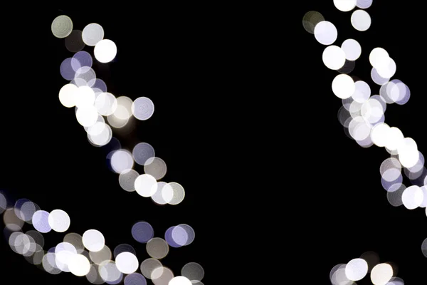 Unfocused abstract white bokeh on black background. defocused and blurred many round light — Stock Photo, Image