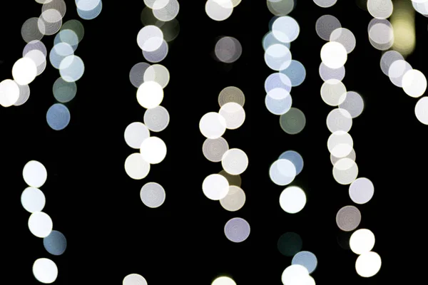 Unfocused abstract white bokeh on black background. defocused and blurred many round light — Stock Photo, Image