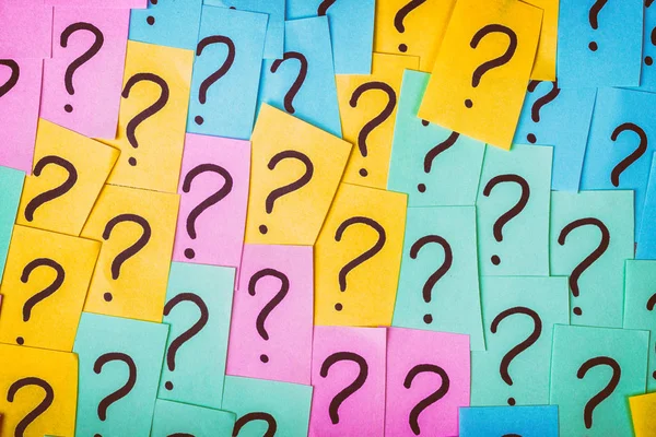 Question marks background. Colorful paper notes with question marks. Concept image. Closeup top view toned — Stock Photo, Image