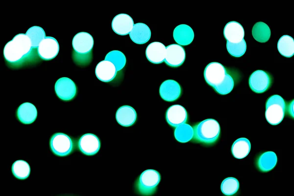 Unfocus astratto colorato bokeh sfondo nero. sfocato e sfocato molti rotonda luce blu — Foto Stock