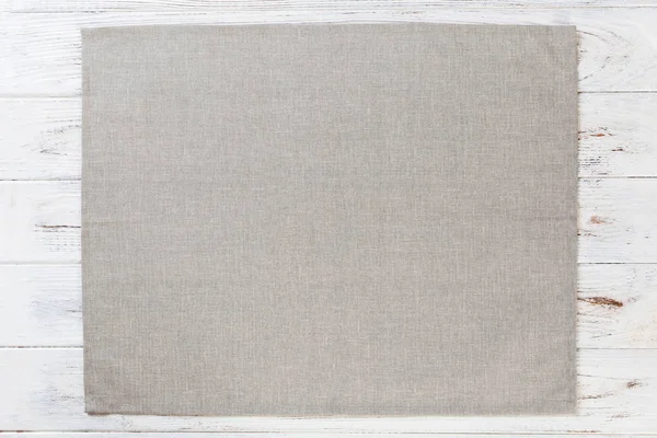 Servilleta de tela gris sobre fondo de madera rústico blanco vista superior con espacio de copia — Foto de Stock