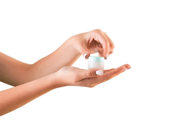 Bottiglia di crema per le mani femminile isolata. Ragazza apertura vaso prodotti cosmetici su sfondo bianco — Foto Stock