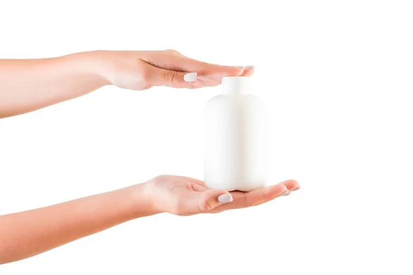 Weibliche Hand hält Cremeflasche mit Lotion isoliert. Mädchen geben Rohr kosmetische Produkte auf weißem Hintergrund — Stockfoto