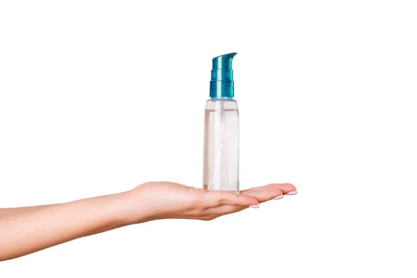 Botella de crema de mano femenina de loción aislada. Chica dar productos cosméticos tubo sobre fondo blanco — Foto de Stock