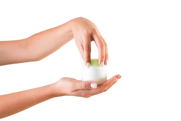 Bottiglia di crema per le mani femminile isolata. Ragazza apertura vaso prodotti cosmetici su sfondo bianco — Foto Stock