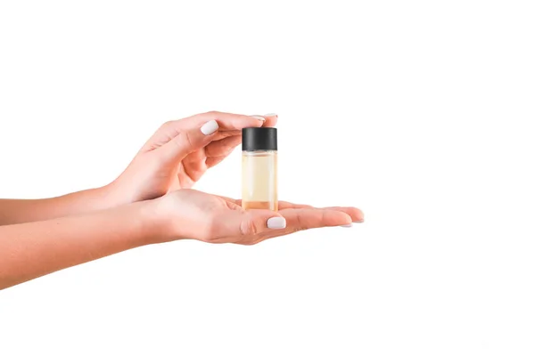 Bottiglia di crema per le mani femminile isolata. Ragazza dare tubo prodotti cosmetici su sfondo bianco — Foto Stock