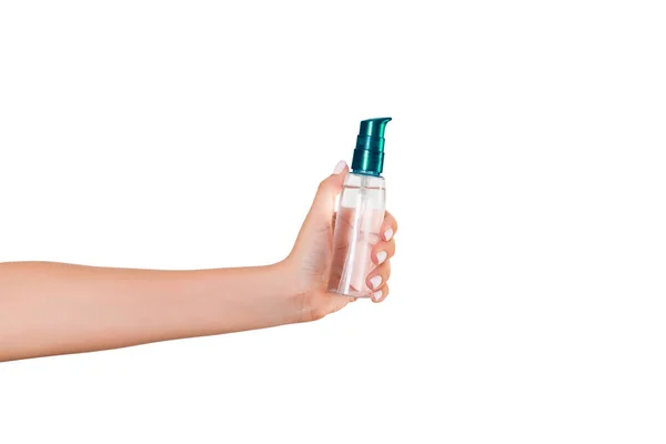 Female hand holding cream bottle of lotion isolated. Girl give tube cosmetic products on white background Stock Photo