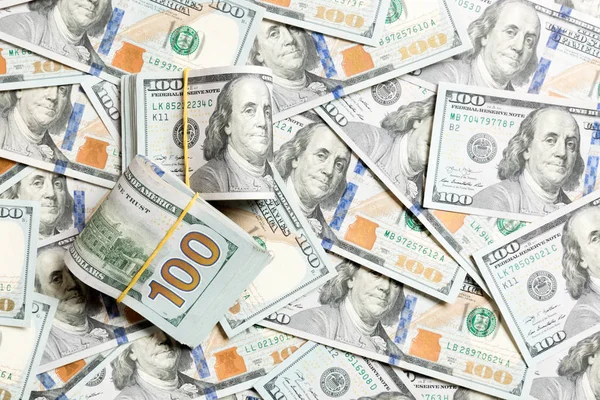 Many Stack of 100 dollar bills on dollars background top wiev with copy space — Stock Photo, Image