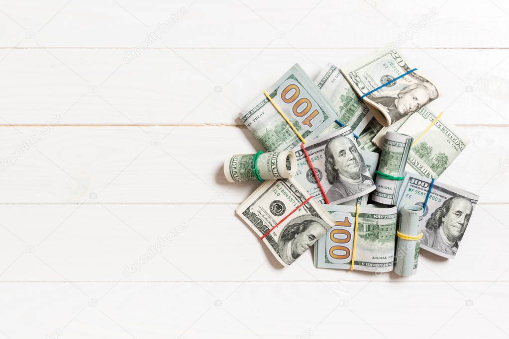 Many Stack of 100 dollar bills. Isolated on colored background top wiev with copy space