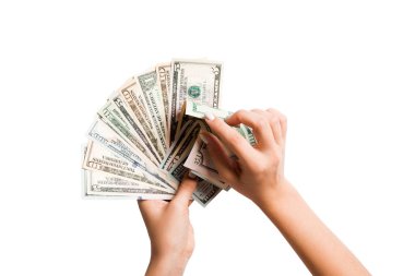 İzole arka planda dolar banknotları bir fan sayma kadın ellerin üst görünümü. Kar ve lüks konsepti