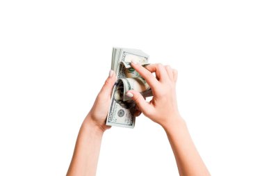 Kadın elinde para demeti üst görünümü. Beyaz izole arka plan üzerinde dolar sayma görüntü. Vergi kavramı