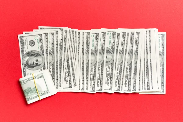 Close up of 100 dollar bills in a row on colorful background. Top view of salary concept — Stock Photo, Image