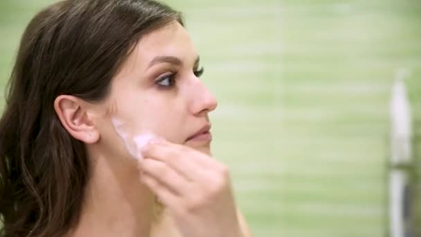 Girl Removes Makeup Using Cotton Pad Green Bathroom — Stock Video