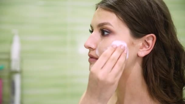 Girl Removes Makeup Using Cotton Pad Green Bathroom — Stock Video