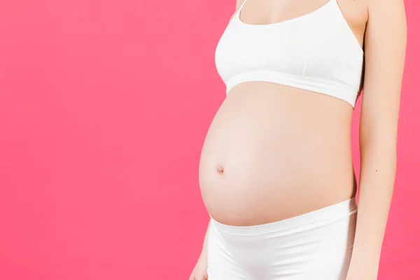 Gesneden Afbeelding Van Buik Van Zwangere Vrouw Roze Achtergrond Toekomstige — Stockfoto