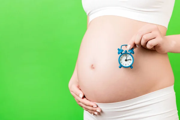 Close Pregnant Woman White Underwear Holding Alarm Clock Her Belly — Stock Photo, Image