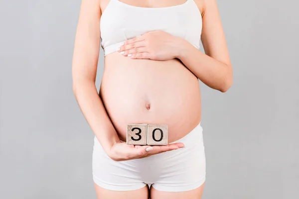 Cropped Image Pregnant Woman White Underwear Showing Thirty Weeks Pregnancy — Stock Photo, Image