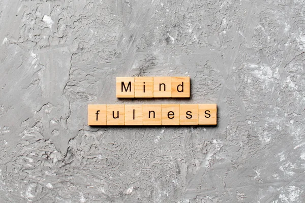 mind fulness word written on wood block. mind fulness text on table, concept.