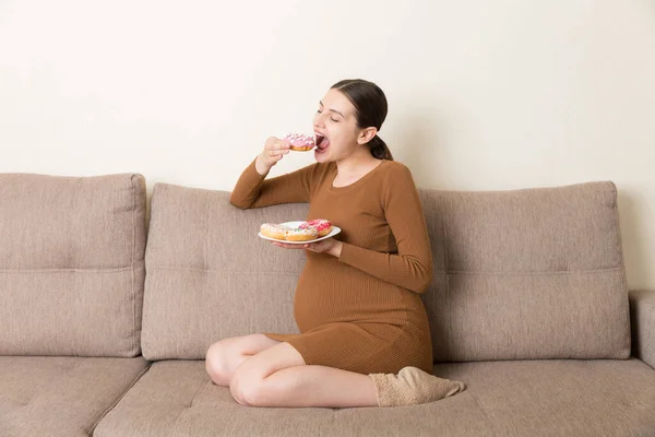 Pregnant Woman Enjoys Eating Different Donuts Resting Sofa Unhealthy Desserts — Stock Photo, Image