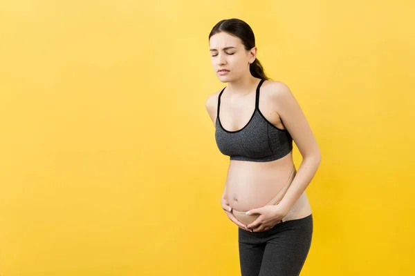 Portrait Supporting Bandage Backache Pregnant Woman Yellow Background Copy Space — Stock Photo, Image