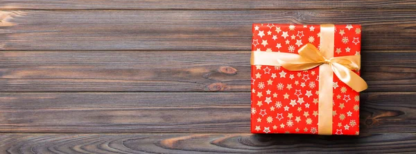 Beautiful Gift Box Colored Bow Dark Wooden Table Top View — Stock Photo, Image