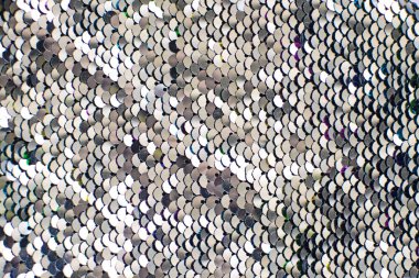 Pieces of cloth with silver sequins. Glitter background. Sequin texture clipart