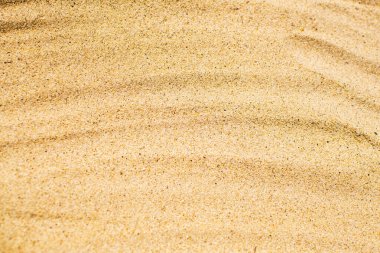 Güzel bej kumlu arka plan. Kum kapanıyor. Tatil ve seyahat kavramı.
