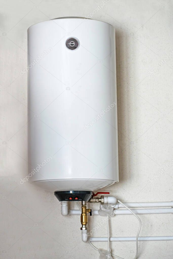 Electric water heater boiler on the wall in the house.