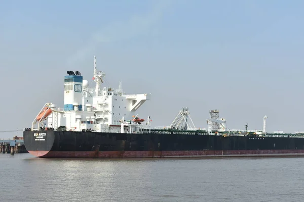 Empty Merchant big ship standing in a port in a vast water