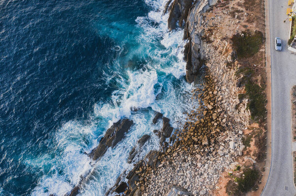 Bird eye view Atlantic ocean Portugal Peniche surfing beach Beleal rocks and cliffs