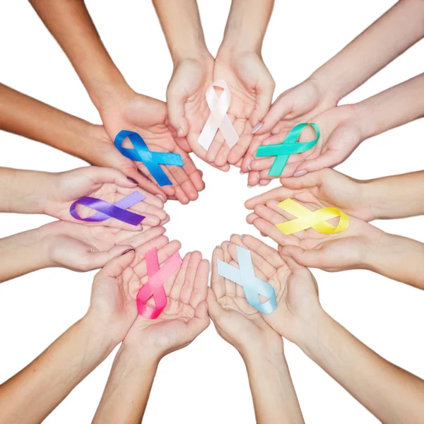 Colorful ribbons, cancer awareness, World cancer day background. many ribbons on hands isolated on white — Stock Photo, Image