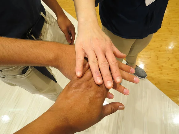 Group Of Hands Joined Together In Agreement